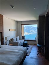 Luxury Hotel Room with View over Mountain and Lake Lucerne in a Sunny Summer Day in Buergenstock