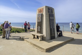 Tourists visiting the Fifth Engineer Special Brigade Memorial at Omaha Beach