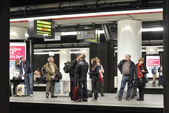 Commuters waiting for train at platform of the Central railway station in Brussels