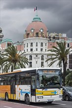 City bus and the Hotel Le Negresco on the Promenade des Anglais in Nice
