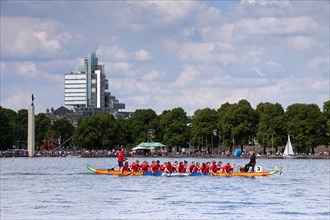 Dragonboat race on the artificial lake Maschsee and the Norddeutsche Landesbank in the background