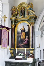 Side altar with banner
