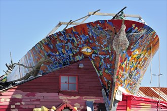 Decorated boat as work of art and artist's home in the harbour of L'Herbaudiere