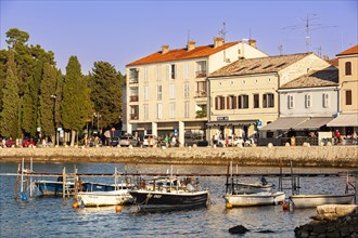 Small fishing boats in the evening in the harbor of Porec