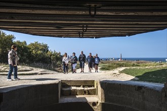 Tourists viewed from Second World War Two bunker at the Pointe du Hoc cliff overlooking the English Channel
