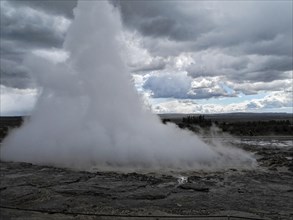 The geyser Stokkur in the hot water valley Haukadalur in the municipality of Blaskogabyggd in the south of Iceland
