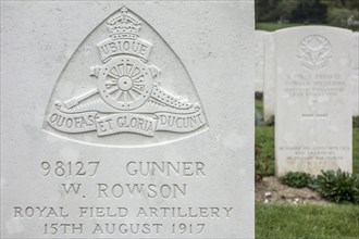 Royal Field Artillery regimental badge on headstone at Cemetery of the Commonwealth War Graves Commission for First World War One British soldiers
