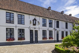 17th century white beguines' houses in courtyard of the Beguinage of Oudenaarde