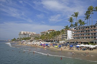 Sunbathers and hotels at Puerto Vallarta