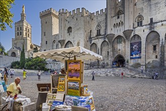 Artist selling paintings in front of the Palais des Papes