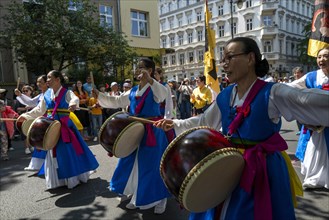Participants in the Carnival of Cultures parade make their way through the streets. Berlin