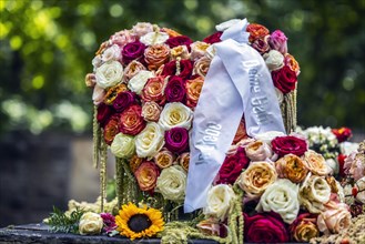 Grave decoration with roses and bow