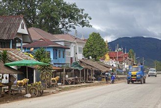 Food stalls along street in village in the Tachileik District