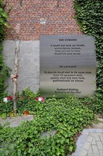 World War One execution pole and epitaph The Coward by Rudyard Kipling at inner courtyard of the Poperinge town hall