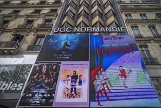 Large posters of a cinema advertisement on the Champs Elysees