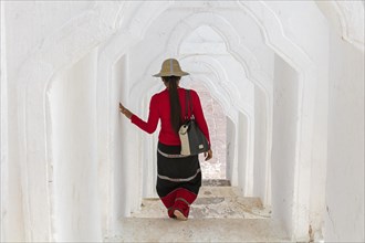 Burmese woman descending stairs in the Hsinbyume pagoda