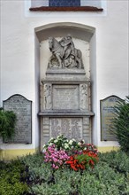 War memorial with floral decorations