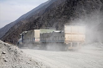 Local truck driving along dusty dirt road in the Quebrada del Toro