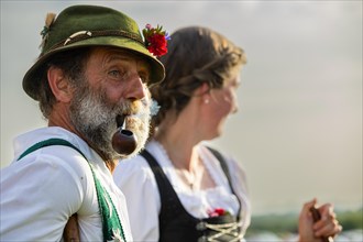Shepherd with pipe and shepherdess in traditional traditional costume