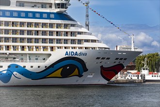The cruise ship AIDADiva at the quay wall of the Warnemuende Cruise Center in the port of Rostock-Warnemuende