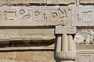 Detail showing ancient Egyptian hieroglyphs on wall of the Luxor Temple in Egypt