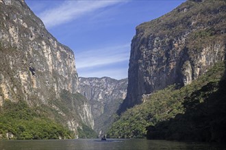 Motorboat with tourists on the Grijalva River in the Sumidero Canyon National Park near Chiapa de Corzo