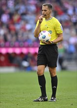 Referee Robert Hartmann blows the whistle
