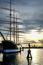 Museum sailing ship Passat in Priewall harbour at sunset