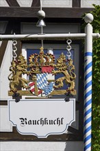 Sign of the Rauchkuchl with lion