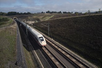 A high-speed train crosses the state of Bavaria on a sunny morning. Luetzelbuch