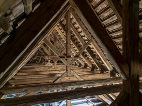 Village church roof truss made of wooden beams
