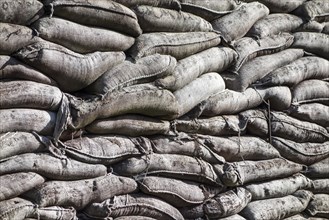 Wall of stacked sandbags in WWI trench used as defence in First World War One warfare
