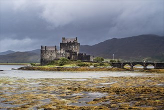 Eilean Donan Castle in Loch Duich during rain shower