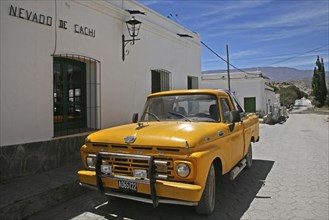 Old yellow Ford pickup truck in Cachi