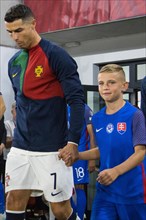 Cristiano RONALDO Portugal with proud Slovakian boy entering the pitch together