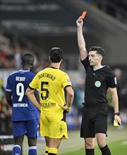 Referee Florian Badstuebner shows Ramy Bensebaini Borussia Dortmund BVB