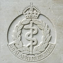 Royal Army Medical Corps regimental badge on headstone at Cemetery of the Commonwealth War Graves Commission for First World War One British soldiers