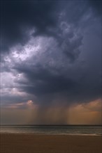 Thunderstorm showing dark rain clouds and cloudburst