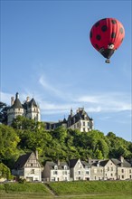 Hot-air balloon flying over the Chateau de Chaumont