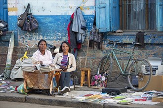Malagasy women selling books and newspapers in the streets of the city Antsirabe