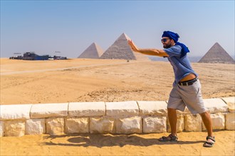 A young tourist joking at The Pyramids of Giza