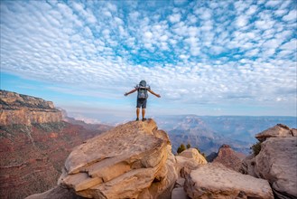 A young man on a viewpoint of the descent of the South Kaibab Trailhead. Grand Canyon