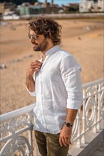 Summer lifestyle with a young dark-haired Caucasian man with long beard