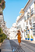 A tourist in Mijas in the white houses charming town in the province of Malaga