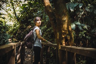 A young tourist inside a bridge in the Cerro Azul Meambar National Park