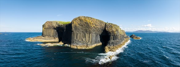 Aerial panorama of the uninhabited rocky island of Staffa with the striking basalt columns and Fingal's Cave