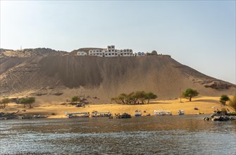 A Nubian village atop a desert sand mountain on the Nile River and near the city of Aswan. Egypt