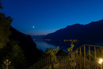 View over Lake Brienz with Mountain and Moon in Dusk in Giessbach in Brienz