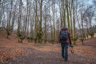 A young man walking through the Otzarreta Forest in the Gorbea natural park