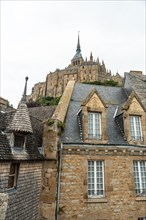 Old wooden dwellings at the famous Mont Saint-Michel Abbey in the Manche department